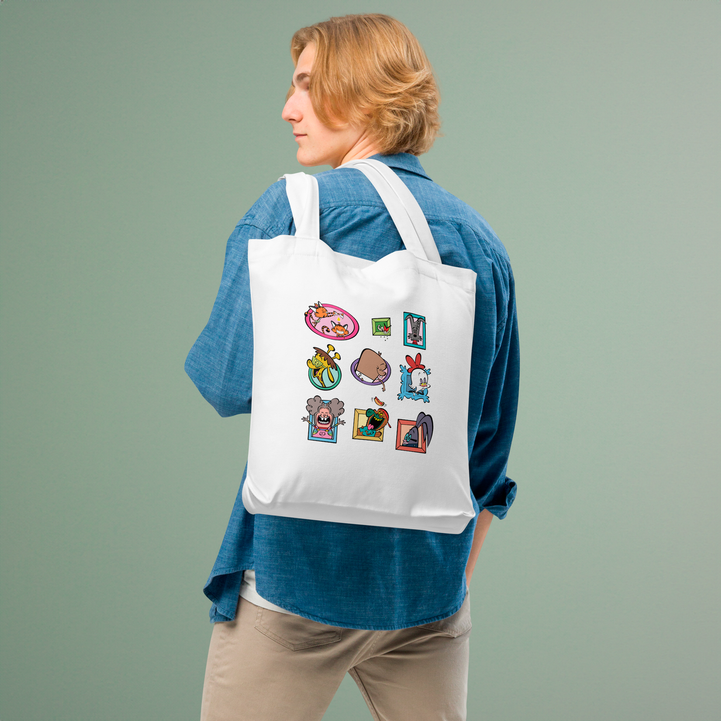 Character cotton tote bag held by person